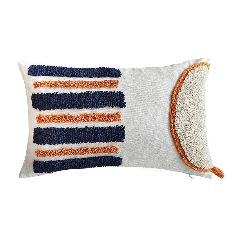 Eye-catching design: The bold combination of orange and blue in the patterned design of this pillow draws attention and adds a vibrant focal point to any space.
