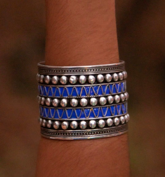 Symbolic freedom: The deep blue studs on this cuff bracelet represent the oceanic hues of the Atlantic, embodying the meaning of freedom cherished by the Berber people and their ancestral connection to the sea.