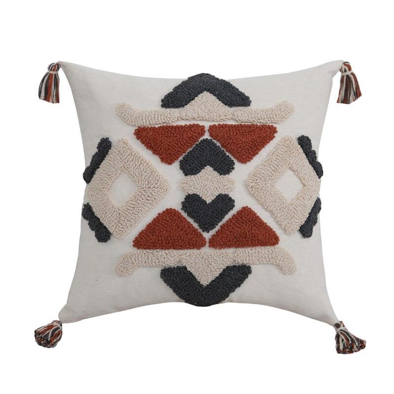 Azilal patterned pillow: This Moroccan-inspired pillow showcases a harmonious blend of colors and patterns, reflecting the rich cultural heritage of the Azilal region. Handcrafted with attention to detail, it adds a touch of exotic charm and artistic flair to your living space.