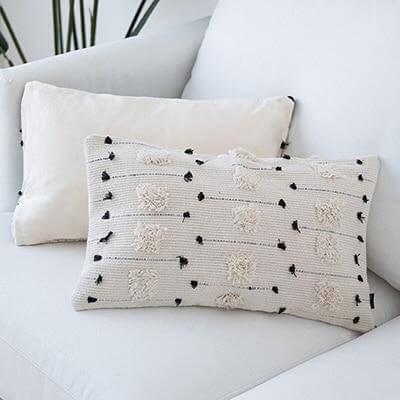 Minimalist decor: Complement your minimalist decor with the Nordic White Pillow with Pom-Poms, offering a simple yet stylish addition to enhance the overall aesthetic of your space. Whimsical details: Delight in the whimsical charm of the pom-pom accents, bringing a touch of playfulness and personality to your home decor.